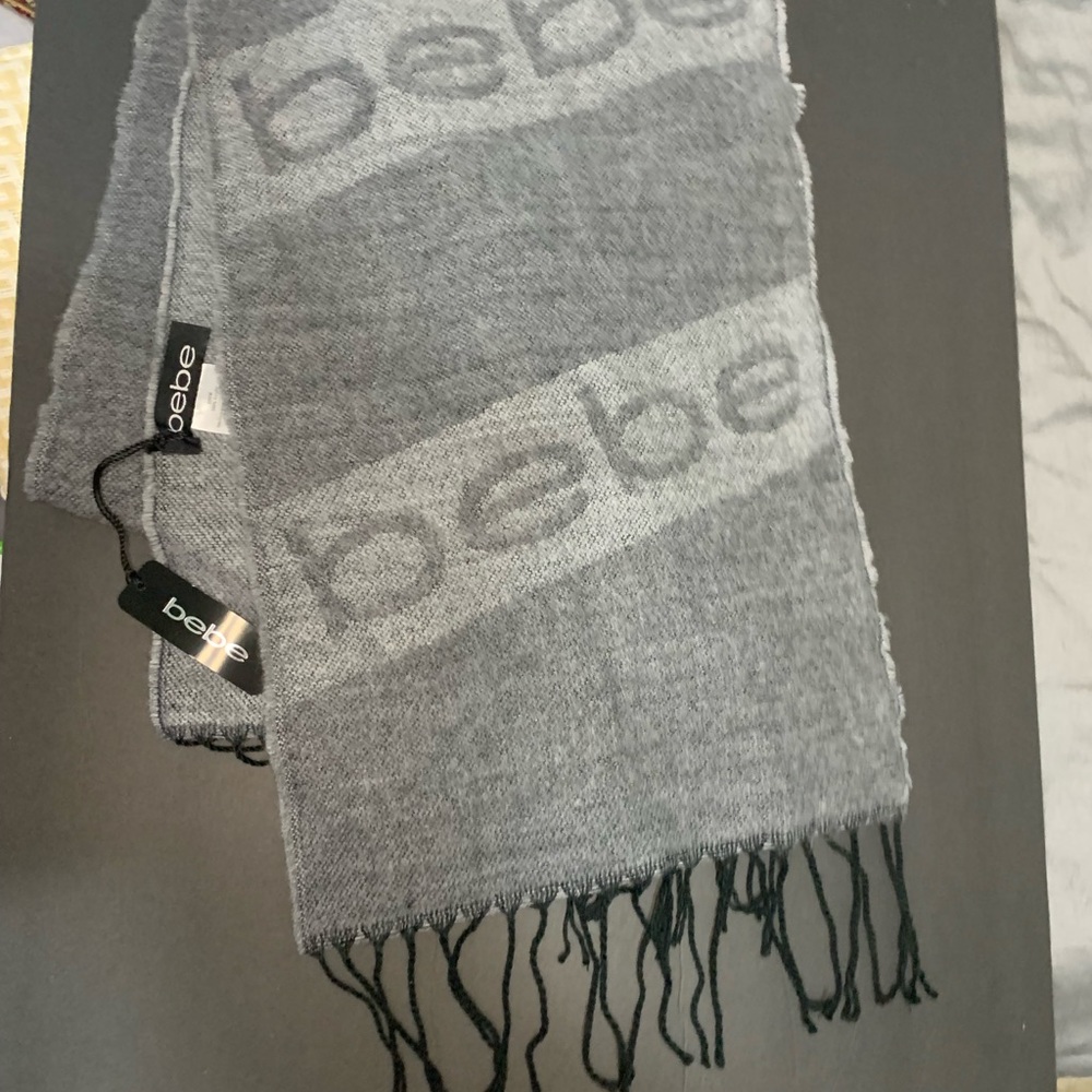 bebe scarf. 73”long 12” wide. Gray, black. New w/tags.Great for fall & winter!